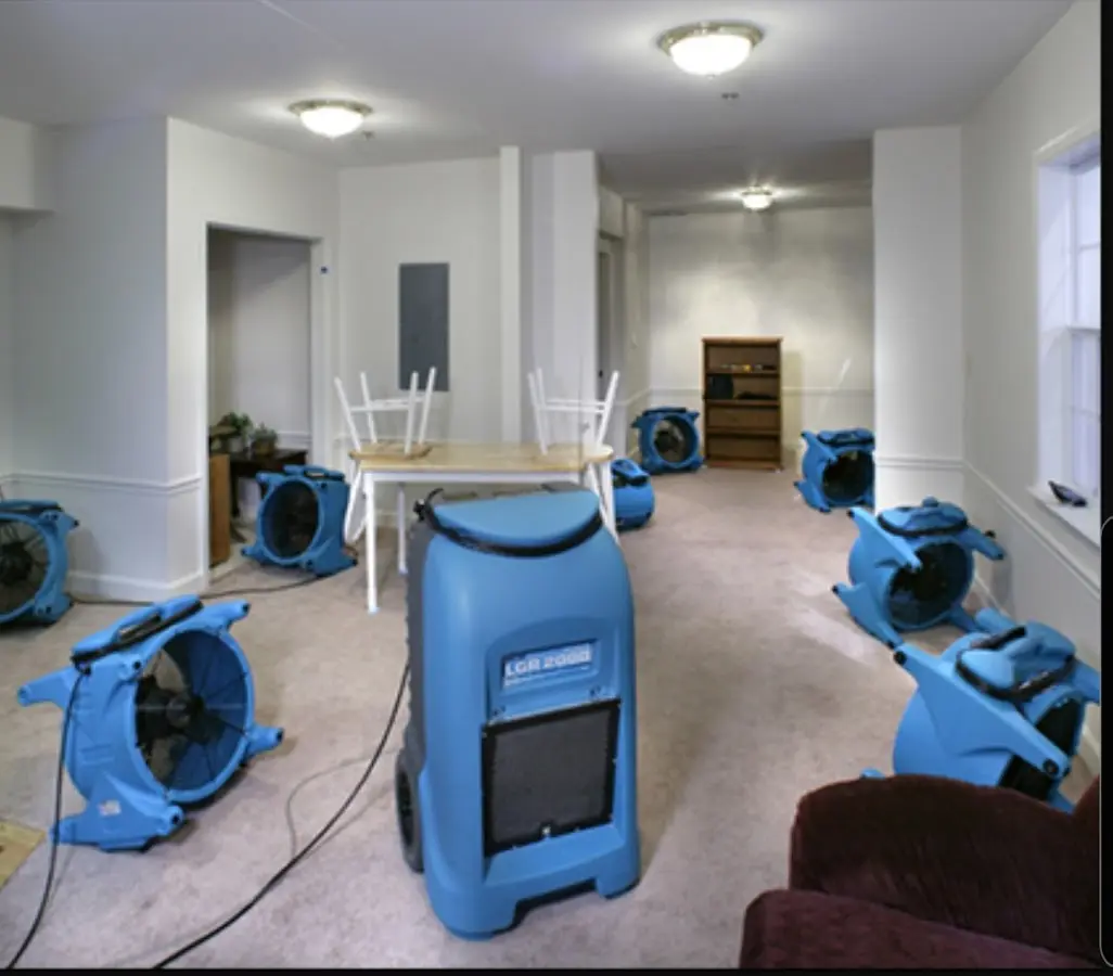 Air movers and dehumidifier setup for Water Damage Restoration in Crosspointe